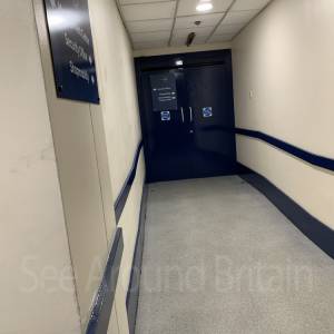 Coming out the lift, head for double doors which open automatically.